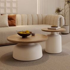 a living room filled with furniture and a bowl of fruit on top of a table