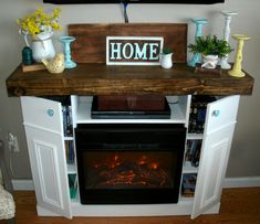 an entertainment center with a fireplace built into it