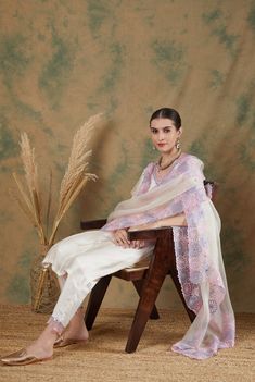 This refreshing ivory kurta set is the perfect addition to your festive wardrobe.
The chanderi kurta has pintuck detailing and delicate scalloped embroidery on neck and sleeves.It is paired with chanderi pants in ivory with delicate embroidery.
The silk organza dupatta has beautiful geometric floral embroidery in lavender and rosepink threadwork which adds a pop of colour to the classic design elevating the overall look. Off White Straight Kurta Anarkali Set In Mulmul, Off White Mulmul Anarkali Set With Straight Kurta, Cream Chanderi Unstitched Straight Kurta Suit, Cream Straight Kurta Anarkali Set In Chanderi, Cream Chanderi Anarkali Set With Straight Kurta, Cream Chikankari Embroidery Kurta In Chanderi, Off White Cotton Silk Sets With Chikankari Embroidery, Cream Chikankari Embroidery Set In Mulmul, Cream Sets With Chikankari Embroidery In Mulmul