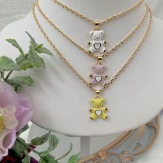 If you are a mama bear, this cute teddy bear necklace is for you! This dainty gold plated necklace is perfect for everyday wear. 💕 ITEM DESCRIPTION: Total length: 14 - 16 - 18 -20 -22  inches. The length of the necklace refers to the total length from end-to-end. Pendant height: 1 inch Pendant width: 0.7 inch Material: 18K Gold Plated Chain - Enamel Bear Charm. Chain color available: Gold. Bear Charm Color Available: Lilac - White - Yellow 💕 GIFT IT Jewelry comes in a cute bag ready to gift! If you wish your item to be a gift, please let me know and I will include a cute little card with a personal message from you. 💕 CARING FOR YOUR JEWELRY: I recommend that you do not wear your jewelry in the shower, in ocean water, or during sporting activities, and avoid exposure to oils, perfumes, Everyday Necklace Gold, Necklace Mama, Teddy Bear Necklace, Mama Bear Necklace, Soul Sisters Gifts, Cute Necklaces, Mommy Necklace, Cute Stud Earrings, Yellow Gifts