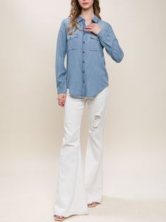 "Introducing our stylish and eco-friendly Long Sleeve Jean Shirt! Made from soft Tencel fabric, this denim blue and white button-up shirt is the perfect addition to your spring, summer, and fall wardrobe. With double pockets and a timeless design, it's perfect for casual outings, vacations, and even resort wear. Upgrade your wardrobe with this versatile and sustainable piece today Super Soft Denim Blouse Available in White and Washed Denim from Small to Large Size. Non Stretch. Regular Fit.  Please check our US number size regarding our S/M/L: Small (US 2-4), Medium (4-6), Large (6-8) Model is Wearing Size Small. Model: 5'9\"  32B bust, 25\" waist, and 36\" hips.  Color may vary slightly due to monitor resolution  100% Tencel NO REFUNDS-please check sizing, Buyer must pay exchange shipping Washed Blue Denim Button-up Shirt, Washed Blue Chambray Button-up Top, Blue Chambray Button-up Denim Jacket, Washed Blue Chambray Button-up Denim Top, Chambray Button-up Shirt With Buttons, Chambray Button-up Shirt, Medium Wash Button-up Denim Top With Buttoned Pockets, Casual Denim Blue Blouse With Buttons, Denim Blue Button-up Top