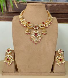 Dazzling Cz stones with crystal-work teamed with a delicate  gold frame instantly elevate any outfit. The set includes a pair of matching dangle earrings. Approximate earrings length is 2.75 inches  Free Shipping A set that has been designed with attention to detail and will compliment any outfit! Elegant Kundan Jewelry With Zari Work, 22k Gold Jewelry With Zari Work For Wedding, Elegant Jewelry With Zari Work For Reception, Festive Temple Necklace With Stone Setting For Wedding, Elegant Zari Work Jewelry For Reception, Festive Wedding Temple Necklace With Stone Setting, Festive Kundan Necklace With Intricate Diamond Design, Hand Set Kundan Bridal Necklace In Yellow Gold, Diamond Chandbali Kundan Necklace Gift