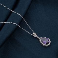 Teardrop Pendant, Amethyst Crystal Pear Necklace, Necklace In Sterling Silver, Purple Droplet Diamond Necklace, Silver Chain Pendant Gift . Pear cut purple amethyst teardrop halo design pendant gift silver necklace is focus on women's jewelry on any outfits for all types of skin tones . All types of customization are available .these pretty classic pendant looks very beautiful gift for her . These is the special gift for your special ones. 🤍🤍 Special gifts for your special moments. We produce Amethyst Crystal Necklace Jewelry, Amethyst Necklaces For Wedding, Purple Drop Necklace For Formal Occasions, Teardrop Amethyst Necklace For Formal Occasions, Formal Purple Drop Necklace, Formal Drop Amethyst Necklaces, Formal Amethyst Drop Necklace, Purple Teardrop Necklace For Jewelry Making, Purple Briolette Necklaces For Wedding