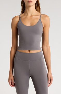 Narrow straps give a cami-hybrid look to a superstretchy tank ideal for workouts and active days. Scoop neck Adjustable straps Partially lined, with pockets to accommodate bra pads 75% nylon, 25% spandex Machine wash, tumble dry Imported Yoga Tank Top With Built-in Bra, Yoga Sports Bra With Adjustable Tank Straps, Workout Sports Bra With Adjustable Tank Straps, Adjustable Straps Sports Bra For Pilates, Sporty Tank Activewear With Built-in Bra, Gray Workout Tank Top With Built-in Bra, Gym Camisole With Built-in Bra And Tank Straps, Cami Sports Bra With Built-in Bra For Gym, Yoga Activewear With Adjustable Tank Straps