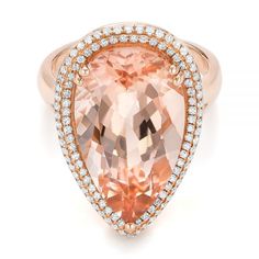 101780 14k Rose Gold Ring   Morganite - 11.01 ctw   Diamonds - .42 ctw   Clarity: I1-I2 - Color: G-H. This ring features a pear shaped morganite surrounded by a double halo of split prong set diamonds and the basket is accented with filigree. Formal Morganite Diamond Ring With Brilliant Cut, Formal Morganite Diamond Ring With Vvs Clarity, Formal Morganite Ring With Brilliant Cut, Elegant Topaz Ring With Pave Setting For Formal Occasions, Elegant Diamond Topaz Ring With Pave Setting, Formal Morganite Diamond Ring, Formal Morganite Diamond Ring Fine Jewelry, Formal Morganite Diamond Ring In Fine Jewelry Style, Luxury 14k Rose Gold Rings With Halo Setting