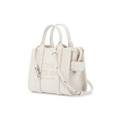 The Leather Mini Tote Bag by Marc Jacobs crafted in grained leather with contrasting lettering logo printed on the front. Double handles, detachable and adjustable shoulder strap, side handle and zipper closure. Unlined interior and silver-tone metalware. White Bags With Double Handle And Logo Hardware, White Double Handle Shoulder Bag With Logo Hardware, White Tote Shoulder Bag With Logo Hardware, Daily Use Double Handle Satchel With Logo Hardware, Leather Satchel With Double Handle And Logo Hardware, White Bags With Logo Hardware For Everyday, Leather Satchel With Logo Hardware For Everyday Use, Modern Satchel With Logo Hardware For Daily Use, Leather Satchel With Logo And Top Handle