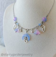 * Pastel Moon and Flowers Charm Necklace * Made with pastel star and flower beads, delicate angel wings, and a charming crescent moon centerpiece, adorned with a tiny heart.  ❀ Materials: Stainless steel, glass beads and zinc alloy charms.  ❀ Length: 42 cm.  ➤ 𝘑𝘦𝘸𝘦𝘭𝘳𝘺 𝘊𝘢𝘳𝘦 ❀ Please handle this delicate product with care. ❀ Please avoid exposing it to water, perfumes, lotions, and harsh chemicals. ❀ Store your jewelry in a dry, clean place to prevent tarnishing and scratches. ➤ 𝘚𝘩𝘪? Moon And Flowers, Necklace Fairycore, Cottagecore Necklace, Pastel Moon, Fairycore Necklace, Diy Luxury, Diy Collier, Neck Jewelry, Celestial Necklace