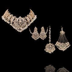 This majestic set has striking, intricate motifs and complex stone work, making it a stunning piece of handiwork! Gloriously enhanced with stone work, this set is one of the most extraordinary pieces in our collection. The set includes a necklace, a matching maang teekah, a jhoomar/passa and a pair of beautiful earrings. Approximate earrings length is 3.75". Gold-plated on high-quality brass as base metal. Made by order. Kindly allow 5-7 weeks for the delivery of this item. For custom or urgent Elegant Kundan Necklace With Stone Work For Navratri, Elegant Ceremonial Tikka With Intricate Design, Wedding And Navratri Stone Work Sets, Elegant Heavy Kundan Necklace For Navratri, Elegant Kundan Sets For Navratri, Elegant Kundan Sets For Ceremonial Occasions, Elegant Lehenga With Intricate Design For Diwali, Elegant Kundan Jewelry Set For Navratri, Elegant Heavy Jewelry Sets For Navratri