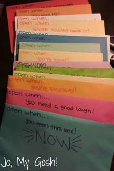 several different colored envelopes with writing on them