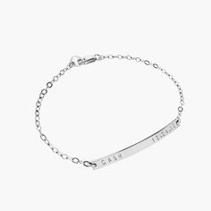 "Our minimal, modern and beautifully made sterling silver name bar bracelet, makes the perfect new mom bracelet! Personalize the bar to never be far from the one you love with a 'name and date' as shown, or personalize in your own way. We can hand stamp the bar with up to 18 characters on the front side, including: numerals, letters, the period mark, an ampersand, a hashtag, and heart. (Back stamping is available by special request). We use a heavy gauge metal to create all our nameplates which Minimalist Sterling Silver Name Bracelet For Personalized Gift, Minimalist Sterling Silver Name Bracelet As Personalized Gift, Dainty Sterling Silver Custom Name Bracelet, Dainty Engraved Bracelet For Everyday Wear, Dainty Engraved Bracelets For Everyday, Dainty Engraved Bracelets For Everyday Wear, Dainty Everyday Engraved Bracelets, Classic Sterling Silver Custom Name Bracelet, Minimalist White Gold Name Bracelet For Everyday