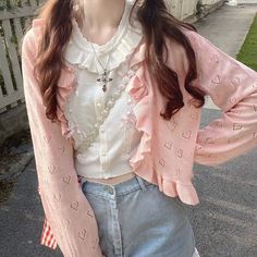 The Sweet Lolita Ruffles Cardigan is the perfect statement piece for your wardrobe. This cardigan features a lightweight, comfortable design with ruffles along the collar and hem for a stylish look. Layer the Sweet Lolita Ruffles Cardigan over your favorite outfit for a classy, elegant look. Pink Ruffled Cardigan For Spring, Pink Ruffled Cardigan For Fall, Pink Casual Cardigan With Ruffles, Casual Pink Ruffled Cardigan, Casual Pink Cardigan With Ruffles, Pink Long Sleeve Cardigan With Ruffles, Sweet Pink Cardigan For Fall, Spring Trendy Ruffled Cardigan, Sweet Long Sleeve Cardigan For Spring