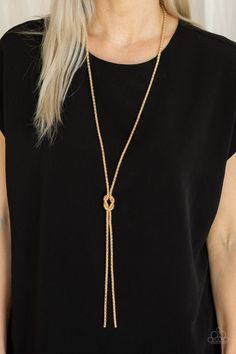 A glistening strand of lengthened gold popcorn chain delicately knots at the chest, creating an edgy tasseled pendant. Features an adjustable clasp closure. Featured inside The Preview at ONE Life! Sold as one individual necklace. Includes one pair of matching earrings. P2ED-GDXX-119XX Gold Lariat Long Necklace, Chic Gold Lariat Necklace, Gold Metal Lariat Necklace For Party, Chic Gold Lariat Necklace With Clavicle Chain, Gold Lariat Necklace With Adjustable Chain For Party, Adjustable Gold Lariat Necklace For Party, Chic Metal Lariat Necklace With Adjustable Chain, Adjustable Lariat Chain Necklace For Parties, Chic Gold Lariat Jewelry