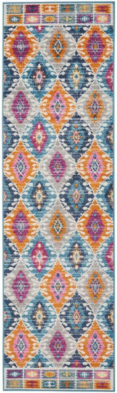 an orange, blue and pink rug with diamond shapes on it's sides in various colors