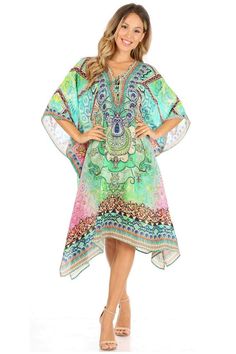 This caftan dress cover up features a beautiful handmade cut. It has a beautiful multi toned tribal pattern print with a v-neck and rhinestone embellishments around the neckline. The dress is long and tall, and has adjustable drawstrings at the neckline that can be left undone or tied as desired. The dress is very lightweight and airy. Tropical V-neck Kaftan For Beach Cover-up, Cheap Multicolor Kaftan As Beach Cover-up, Vibrant Print V-neck Kaftan For Beach Cover-up, Multicolor Batik Print Kaftan For Beach Cover-up, Poncho Outfit, Bohemian Multicolor Print V-neck Kaftan, Caftan Dress, Dress Cover, Cover Up