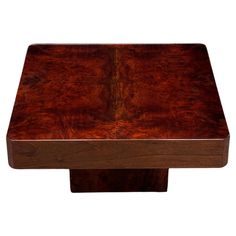 a wooden table with a square shaped top