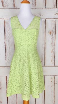 "90s vintage light green stretch lace floral eyelet dress/sheer lace dress/short green lace dress Features... -light green stretch eyelet lace -stretch lining -back zipper -fitted style -label: Maria Bonita  Measurements... taken flat      -estimated fit: ladies small      -marked size: juniors medium      -pit to pit: 17\"       -across waist: 13.5\"       -length: 34\"      Condition... -excellent vintage condition -minimal wear WS087" Spring Baptism Lace Dress, Summer Stretch Dress With Lace Trim, Fitted Green Spring Dress, Fitted Lace Dress With Lace Patchwork For Spring, Summer Knee-length Dresses With Lace Work, Green Fit And Flare Dress For Summer, Vintage Lace Dress With Scalloped Lace For Summer, Fitted Summer Dresses With Lace Work, Fitted Lace Patchwork Dress For Summer