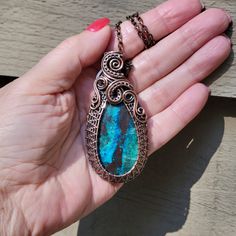 This is a stunning natural Shattuckite stone that I wrapped up all nice and snug in solid copper wire and then oxidized (antiqued) the copper to bring out the texture and pattern of the wire work. Truly and heirloom piece of wearable art to pass down for generations! It measures approximately 2 - 3/4 inches long by 1 - 1/4 of an inch wide and you can purchase just the pendant, add a free adjustable leather or vegan cotton cord, or purchase a matching copper chain to customize it to your liking. This would make a great addition to your jewelry collection or a timeless, unique gift for a friend or loved one! SHATTUCKITE is associated with the throat and third eye chakras and it known to encourage us to be less emotionally-driven, and instead to be realistic and curious.  It gently reminds us Spiritual Chrysocolla Necklace As A Gift, Spiritual Chrysocolla Necklace For Gifting, Handmade Chrysocolla Oval Pendant Jewelry, Handmade Oval Pendant With Gemstone, Chrysocolla Large Pendant Jewelry For Gift, Chrysocolla Large Pendant Jewelry Gift, Chrysocolla Necklace With Large Pendant As Gift, Handmade Chrysocolla Pendant Jewelry, Chrysocolla Oval Pendant Necklace As Gift