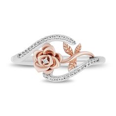 Enjoy the whimsical yet romantic design of this diamond bypass rose ring from the Enchanted Disney Fine Jewelry Collection inspired by Belle. Crafted in sterling silver A 10K rose gold flower sparkles with a single diamond inside the bloom. Bypassing ribbons of shimmering diamonds highlight the sideways centrepiece. This ring captivates with 1/10 ct. t.w. of diamonds. ©Disney Belle Rings, Disney Wedding Rings, Princess Wedding Rings, Disney Engagement Rings, Wattpad Ideas, Disney Rings, Unique Engagement Rings Rose Gold, Rose Gold Bridal Set, Pink Wedding Rings