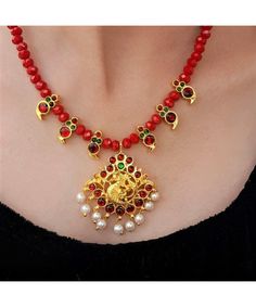 Product Description :  Handmade High quality Gold plated Maroon Kemp Annapakshi Pendant with Maroon Kemp Mango motif and Red Crystal beads Necklace Set with adjustable dori for perfect fitting. A perfect choice for your jewellery collection. Suitable for Wedding, ethnic wear, festive and party wear. A beautiful gift for your loved ones. This product is especially handmade for you after receiving the order and takes 4 to 5 man hours to complete, hence slight imperfections are expected which is not a defect.  Slight color variation of the product may occur due to photographic light effect. Necklace Weight : 40 gms Dimensions : Necklace Length (w/o dori) - 21 cm, Dori Length - 26 cm, Pendant Height - 5 cm , Pendant Width - 4 cm Earring Height - 1.5 cm, Earring Width - 0.7 cm Material : Alloy Red Necklaces With Motifs For Gifts, Red Necklaces With Motifs For Festivals, Red Temple Jewelry Necklace With Peacock Design, Red Peacock Design Temple Jewelry Necklace, Traditional Red Necklaces With Motifs, Red Jewelry With Motifs For Puja, Red Kundan Necklace With Round Beads For Celebration, Red Kundan Beaded Necklaces For Celebration, Red Kundan Beaded Necklace For Celebration