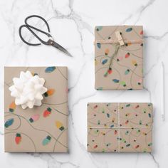 wrapping paper and scissors on a marble surface