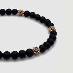 Effortless style is good manners. CRAFTD for individuality, every semi-precious Onyx stone displays its own unique markings, resulting in a truly one-of-a-kind piece. Enhanced with 18K gold beads, its relaxed aesthetic becomes the ideal companion for those essential laid-back days. Qualities: Sharpened Focus ✓ Semi-Precious Onyx Stone✓ 18K Gold & 316L Stainless Steel ✓ Water, Heat, Sweat Resistant Model is 5'11 & Wears Size 19cm. Luxury Beaded Onyx Jewelry, Luxury Onyx Beaded Jewelry, Luxury Hand-strung Round Bracelet, Modern Bracelets With Natural Stones, Elegant Agate Beaded Bracelets For Gift, Modern Adjustable Jewelry With 8mm Beads, Luxury Adjustable Gemstone Beaded Bracelets, Modern Natural Stone Round Bracelets, Timeless Adjustable Beaded Bracelets For Formal Events