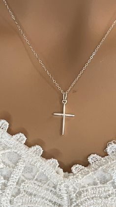 "Silver cross necklace, For Wife gift, Sterling Silver Cross Necklace, Cross Necklace Gift, Cross Necklace, Mother's day gift, Gift for Her. Sterling silver jewelry is the best gift for giving! Necklace features: * Sterling silver small cross charm about 22 X 12mm with the jump-ring * Sterling silver delicate chain * All components are 100% high-quality SOLID sterling silver * Sterling silver 16\" fine chain length that show in the photo, finished with spring clasp." White Cross Necklace For Mother's Day, White Cross Necklace As A Gift, Mother's Day White Cross Necklace, Crucifix Charm Necklaces For Gifts, Gift Crucifix Charm Necklace, Cross Necklace For Mother's Day Gift, Dainty Cross Necklaces For Mother's Day, Cross Necklace For Mother's Day, Dainty Cross Necklace For Mother's Day