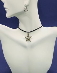 Add a touch of celestial elegance with our Star Charm Necklace, a beautiful piece that shines with every outfit. Embrace the nostalgic vibes of the early 2000s with our trendy Y2K Necklace, perfect for a retro-inspired look. Explore the mysteries of the universe with our Sacred Geometry collection, featuring intricate designs that captivate and inspire. The Star Choker Necklace offers a delicate yet bold statement, while our Charm Choker Necklace is perfect for layering and personalization. For Festival Choker Necklaces With Adjustable Cord, Festival Choker Necklace With Adjustable Cord, Trendy Star Charm Festival Jewelry, Festival Jewelry Choker With Adjustable Cord, Festival Choker Jewelry With Adjustable Cord, Star Charm Necklace For Festivals, Bohemian Star Charm Choker, Festival Metal Necklace With Adjustable Cord, Handmade Adjustable Star Necklace