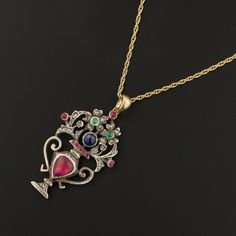 a necklace with an ornate design and colorful stones