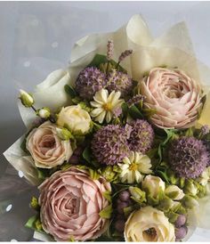 a bouquet of flowers sitting on top of a table