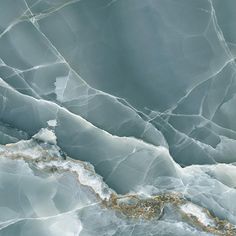 an aerial view of the surface of ice with gold and white paint on it's edges