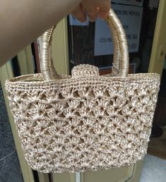 "Welcome! A beautiful vintage beige raffia handbag In good vintage condition! Measures: W: 9.24\" (24 cm) H with handles: 9.24\" (24 cm) Deep: 3.5\" (8 cm) Thanks for stopping by!!IMPORTANT: Due to the delicate situation We're all going through, and in order to keep the safety of courier workers too, all orders will be dispatched when alert sanitary finished. You can purchased or reserve items like always. Thanks so much for your understanding." Cream Woven Evening Bag, Beige Basket Shoulder Bag With Detachable Handle, Elegant Natural Crochet Bag With Double Handle, Gold Woven Top Handle Straw Bag, Beige Straw Bag With Top Handle, Elegant Natural Straw Bag With Top Carry Handle, Evening Crochet Bag With Braided Handles In Natural Color, Elegant Basket Straw Bag With Rolled Handles, Beige Straw Evening Bag