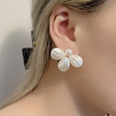 Dainty white flower pearl stud earrings, this pearl earring can be used as a reward for yourself or as a gift for a friend. Perfect gifts for happy birthday, New Year, Valentine's Day, Mother's Day, Thanksgiving Day, Chrism. ✨Product Details 𖧹 Base Metal: Sterling Silver (S925) 𖧹 Pearl Size: 10mm 𖧹 Gemstone: Mother Of Pearl 𖧹 Two studios (New York and Florida): Handcrafted in NY Studio  ✨Our jewelry is packaged in an ornament box or envelope. To avoid waste, usually more than one item will b White Flower-shaped Earrings For Party, White Flower-shaped Party Earrings, Flower-shaped Pearl Drop Earrings For Party, White Round Flower Earrings For Wedding, White Flower Earrings For Wedding, White Flower Shaped Bridal Earrings For Party, White Pearl Clip-on Earrings For Party, White Flower-shaped Clip-on Earrings For Formal Occasions, White Flower-shaped Clip-on Earrings For Formal Events