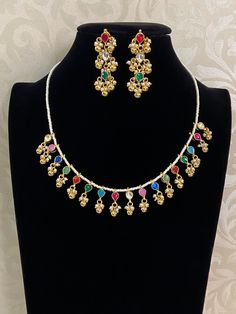 Multi color ahamedabadi kundan necklace with earrings Festive Multicolor Kundan Necklace With Latkans, White Necklace With Gota Work For Festive Occasions, White Gota Work Necklace For Festive Occasions, White Necklaces With Gota Work For Celebration, Multicolor Necklaces With Latkans For Festive Occasions, Multicolor Latkans Necklace For Festive Occasions, Festive White Necklace With Gota Work, Festive White Embellished Necklace, Multicolor Kundan Necklace With Gota Work