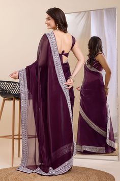 Elegance meets tradition in this stunning Art Silk saree, perfect for the festive season. The rich fabric drapes beautifully, enhancing your silhouette with every step. Intricate border work adds a touch of glamour and sophistication, making it a timeless addition to your ethnic wardrobe. Whether you're attending a wedding or celebrating a festival, this saree is sure to make you stand out in style. Festival Georgette Pre-draped Saree With Border, Eid Chanderi Pre-draped Saree With Traditional Drape, Eid Chanderi Pre-draped Saree, Eid Puja Blouse With Sheer Dupatta, Dola Silk Pre-draped Saree With Embroidered Border For Puja, Traditional Pre-draped Saree With Cutdana For Navratri, Traditional Purple Pre-draped Saree For Navratri, Navratri Cutdana Pre-draped Saree, Pre-draped Saree With Dupatta For Puja