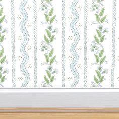 a white and green striped wallpaper with flowers