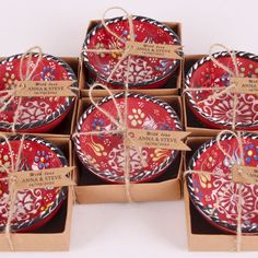 six red and white plates wrapped in twine