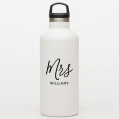 a white stainless steel water bottle with the word boss on it and black handle, against a white background