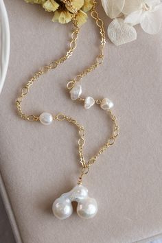 A unique shape of Baroque Pearl is crafted into this chic necklace, possessing an ivory hue and exquisite glimmer, like a pair of cherries crafted by Mother Nature. The handmade pearl chain is completed with a lobster clasp, and I specially selected Baroque Pearl for its added personality. This stylish and beautiful necklace makes a perfect addition to any everyday look, and it also pairs well with other necklaces in a layered style. The necklace length is approx. 16". Follow me on Instagram: @c Pearl Chain Necklace, Chic Necklace, Instagram C, Beautiful Necklace, Pearl Chain, Baroque Pearls, Mother Nature, Crystal Necklace, Beautiful Necklaces