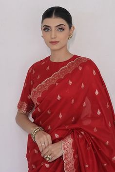 Red saree crafted in moonga silk with gold toned mughal flora vine woven detail along the scallop border and damask butti detail. Paired with a matching half sleeves closed round neck blouse. - Aza Fashions Saree With Full Sleeves, Red Banarasi Saree, Scallop Border, Red Saree, Blouse For Women, Saree With Blouse, Sarees Online, Aza Fashion, Half Sleeves