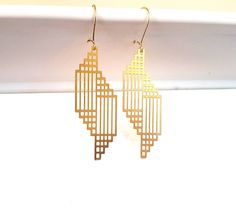 Art Deco Geometric Abstract Drop Earrings gold brass geo modern minimalist dangle statement trending elegant gift for her Mother's day These beautiful statement earrings are perfect for those who love geometric linear shapes. Fresh and modern. The laser cut drops have a mesh design. The earrings are light weight and comfortable on. All components are made from solid raw brass which has a lovely golden glow. Elegant Geometric Gold Earrings, Elegant Gold Geometric Earrings, Modern Geometric Linear Earrings For Gifts, Geometric Brass Earrings For Gift, Modern Gold Linear Earrings For Gift, Modern Geometric Gold Jewelry, Modern Gold Geometric Earrings, Modern Geometric Gold Earrings, Gold Geometric Earrings For Everyday