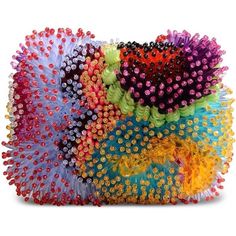 several different colors of hairbrushes stacked on top of each other