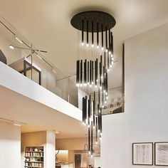 a living room filled with furniture and a spiral chandelier