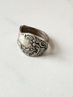 Vintage silver tone silverware ring. Era✦ n/a Material✦ marking on inside (see pic) Closure✦ n/a Condition✦ excellent vintage, some patina. ✂Measurements✦  currently ring size 8 ★ALL SALES ARE FINAL★ There will be no returns or exchanges. Please carefully check measurements. Feel free to contact me with any questions before purchasing. Behind the Scenes / Instant Shop Updates➸ Instagram: mstipsvintage Handmade Vintage Open Engraved Ring, Vintage Silver Open Ring Jewelry, Antique Silver Adjustable Victorian Ring, Antique Silver Open Signet Ring, Silver Antique Signet Ring, Handmade Antique Silver Vintage Rings, Adjustable Antique Silver Victorian Ring, Handmade Vintage Antique Silver Rings, Vintage Silver Engraved Ring