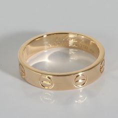 Cartier Love Band in 18k Yellow Gold  PRIMARY DETAILS  SKU: 140024  Listing Title: Cartier Love Band in 18k Yellow Gold  Condition Description: Cartier's Love collection is the epitome of iconic, from the recognizable designs to the history behind the line-up. The collection started in 1969 with the bangle bracelet, which is engraved with a circular motif throughout to mimic the look of the bracelet's signature screw-lock mechanism.     Retails for 1250 USD. In excellent condition and recently polished. Ring size is 48. Comes with Box;  Brand: Cartier  Collection/Series: Love  Metal Type: Yellow Gold  Metal Purity: 18k  Ring Size: 48  Pre-Owned Jewelry Condition: Excellent  SIDE STONE INFORMATION  Original Box?: Yes  Original Papers?: No  This item has been used and may have some minor fla Gold Cartier Diamond Ring, Luxury Cartier Diamond Ring, Cartier Gold Round Cut Diamond Ring, Cartier Gold Diamond Ring With Round Cut, Gold Cartier Diamond Ring With Round Cut, Designer 14k Gold Wedding Rings, Designer Rings With Polished Finish For Anniversary, Designer White Gold Promise Ring, Luxury Cartier Round Cut Rings