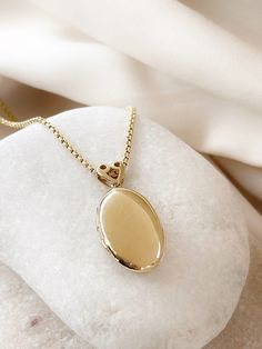 Our oval locket necklace, which we have carefully designed to meet the demands from you, is 14k real yellow gold. Bridesmaids have been presented to our esteemed guests as a unique work for special occasions such as weddings, Anniversaries, birthdays.  ✪ Handmade / Handcrafted Fine Jewelry   ✪ Gold Weight: Approx. 3.86-5.5 g  ✪pendant weight: 4.25 g  ✪ Metal:  14K Solid Gold   ✪ Gold Color: White gold, Rose gold, Yellow gold ♡ For questions or special designs, please contact us via message. We a Gold Oval Locket, Classic Oval Locket Necklace Stamped 14k, Dainty 14k Gold Locket Necklace, Dainty Gold Oval Locket Necklace, Elegant Gold Oval Pendant Locket Necklace, 14k Yellow Gold Locket Necklace For Anniversary, Elegant Oval Locket Necklace As A Gift, Dainty Gold Oval Pendant Locket Necklace, Elegant Oval Locket Necklace For Gift