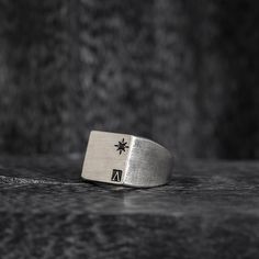 Introducing the Oval Signet Ring - a reworked design that exudes elegance and sophistication. This ring features the iconic message ____ engraved around the crown, serving as a reminder of the wearer's triumphs and accomplishments. Crafted in the classic signet ring style, this piece is a timeless addition to any jewelry collection. The oval shape adds a modern touch, while the intricate details showcase the expert craftsmanship. With its meaningful message and beautiful design, this ring is perfect for those who want to make a statement and leave a lasting impression. "All conditioned things are Impermanent."-Sterling silver 925.-Size: 20mm by 15mm. Thickness 1-2mm.-Engraved around the crown. Specifications -Signet Ring style, reworked design. -Sterling silver 925. -Size: 20mm by 15mm. Th Symbolic Signet Ring With Engraving For Promise, Elegant Formal Ring With Engraved Logo, Elegant Formal Rings With Engraved Logo, Elegant Silver Jewelry With Engraved Logo, Elegant Engraved Logo Ring For Formal Occasions, Luxury Silver Jewelry With Engraved Logo, Classic Formal Rings With Engraved Logo, Classic Formal Jewelry With Engraved Logo, Classic Ring With Engraved Logo