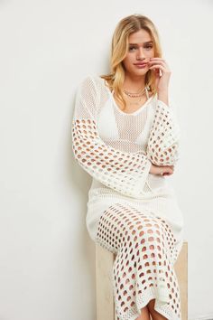 Stay cool and stylish all summer long with our Inda open knit dress. This cute cover up in crisp white will be your go-to for beach days and beyond. Perfect for a fun and flirty look, this dress is sure to turn heads. (Dress to impress, am I right?) -true to size Chic Open Knit Dress For Beach Cover-up, White V-neck Crochet Dress For Beach, White Breezy Cover-up For Vacation, White Crochet V-neck Dress For Beach, White Breezy Cover-up For Poolside, White Beachy Crochet Dress With V-neck, Open Knit Dress For Beach Cover-up, White V-neck Crochet Beach Dress, White Long Cover-up For Beach Season