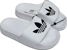 White Synthetic Slip-on Slippers, Casual White Slip-on Flip Flops, Comfortable White Slip-on Sandals, Casual White Vacation Slippers, White Non-slip Slippers For Vacation, White Casual Beach Slippers, Summer Adidas Slides, Adidas Non-slip Summer Slides, White Non-slip Beach Slippers