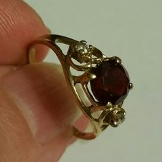 Gorgeous Round Garnet With 2 Brilliant Round Clear Stones, In 14k Gold. Garnet Is The January Birth Stone Beautiful Ring. Great Sweet Sixteen, Or Any Other Occasion Gift! Includes Pouch For Safe Keeping. Garnet Jewelry Aesthetic, Engagement Rings Garnet, Garnet Ring Engagement, Gold Garnet Ring, Garnet Ring Vintage, Garnet Engagement Ring, Garnet Jewelry, Garnet Ring, Clear Stone