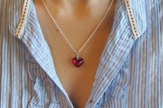 Full of Sparkles, Heart Shaped Red Cubic Zirconia suspended on Sterling Silver 18" length chain. Only one piece made for that special someone! Wrapped in Belesas Branded Box ready for gift giving.(n201)The lovely heart measure 15mm x 12mm*LIKE* us on Facebook http://www.facebook.com/Belesas to find special coupon codes,*FOLLOW* us on Twitter https://twitter.com/#!/Belesas to get more exclusive coupon codes*All item are ready to ship! Free shipping on orders over $150 using coupon code BELESAS150 Red Heart Necklace With Birthstone For Gift, Red Heart Necklace With Birthstone As Gift, Red Heart Birthstone Necklace Gift, Red Birthstone Heart Necklace For Gift, Personalized Red Heart Cut Necklace, Red Crystal Necklace For Valentine's Day, Red Birthstone Necklaces For Anniversary Gifts, Red Heart Cut Necklace For Wedding, Red Heart Charm Necklace For Wedding